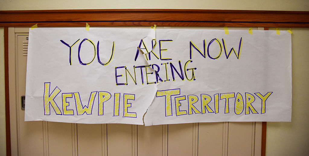 A welcome sign hangs above lockers for students to see as they enter the school
